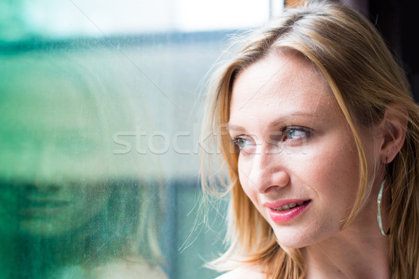 Сток-фото: женщину · Постоянный · окна · глядя · за · пределами · красивая · женщина