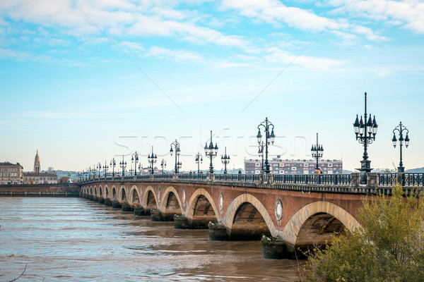Bordeaux river bridge with St Michel cathedral Stock photo © ilolab