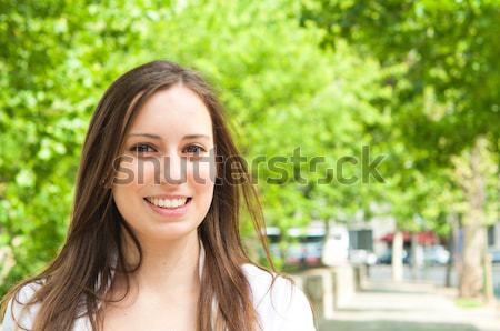 woman smiling while looking back Stock photo © ilolab