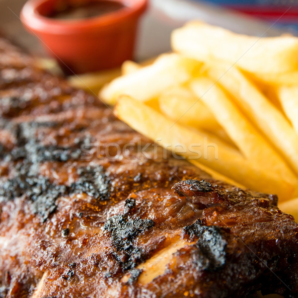 Gegrillt Steak gegrilltes Fleisch Rippen Platte hot sauce Stock foto © ilolab