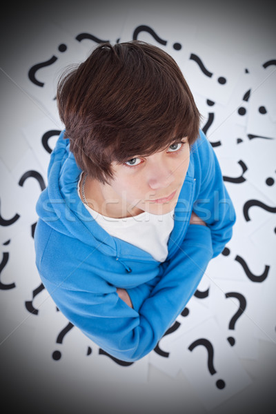 Stock photo: Teenager with questions and doubts