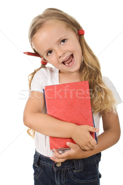 Stock photo: Happy little girl with books and pencil behind the ear