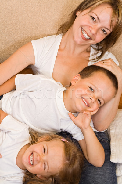 Familia sofá familia feliz relajante mujer nina Foto stock © ilona75
