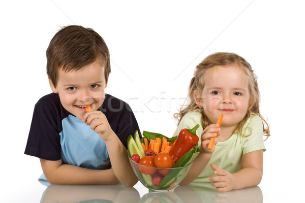Happy kids eating vegetables Stock photo © ilona75