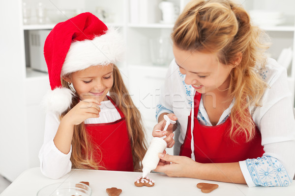 Decorating the gingerbread cookies Stock photo © ilona75