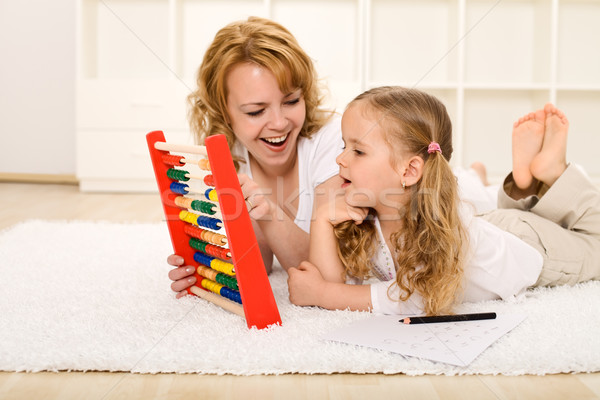 Stock photo: Doing math exercises with mom