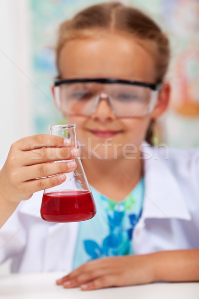 Little girl in elementary school chemistry class Stock photo © ilona75