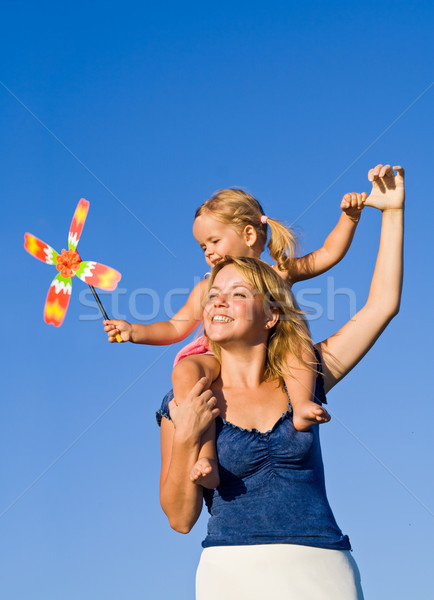Stock photo: Woman with little girl playing outdoors