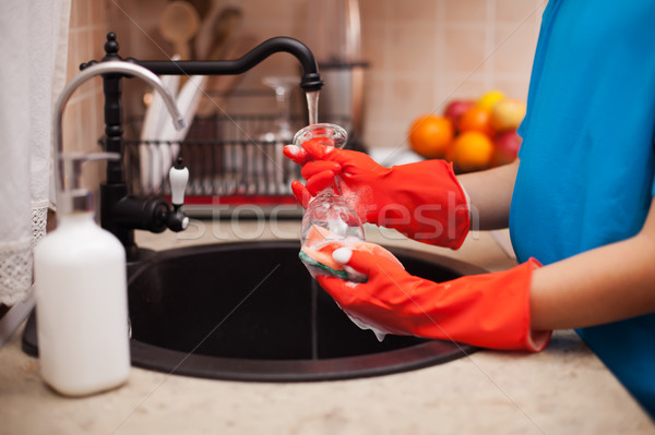Washing the dishes after a meal - child hands scrubbing a glass, Stock photo © ilona75