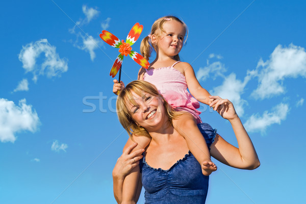 Woman with little girl against summer sky Stock photo © ilona75