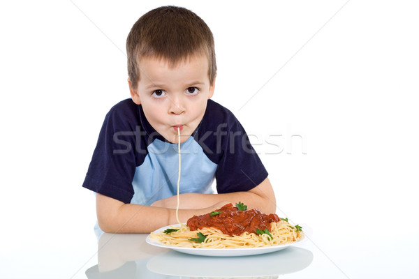 Kid sipping up pasta Stock photo © ilona75