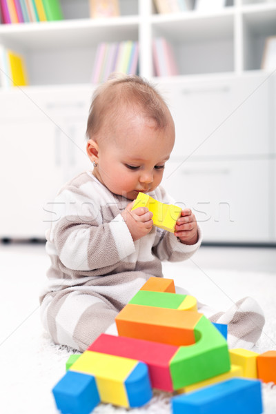 Stock photo: Baby girl playing