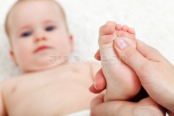 Baby foot massage Stock photo © ilona75