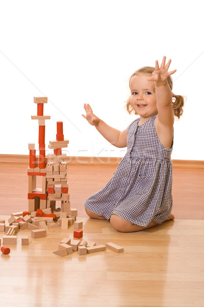 Boldog kislány fakockák játszik padló épület Stock fotó © ilona75
