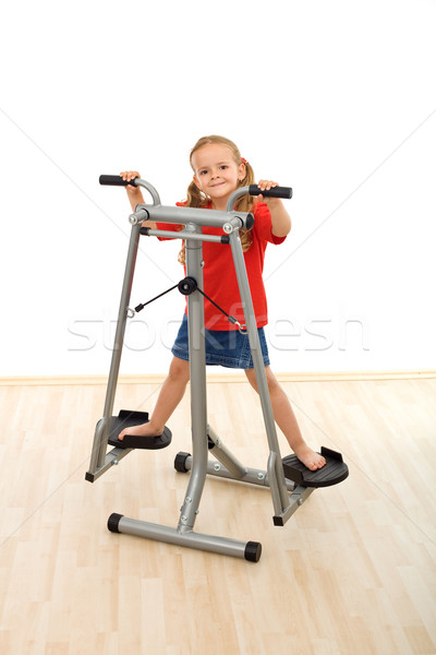 Little girl playing on stretcher device in the gym Stock photo © ilona75