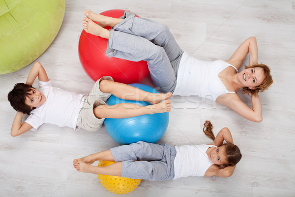 Abdominal workout - woman and kids doing gymnastic exercises Stock photo © ilona75