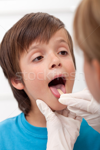 Boy showing her throat to health professional Stock photo © ilona75