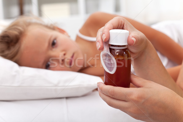 Sick child awaits medication syrup Stock photo © ilona75