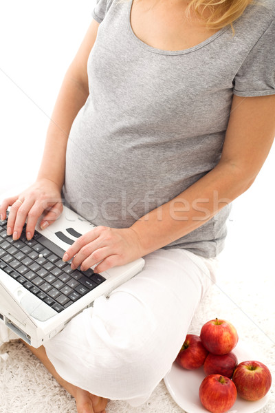 Pregnant woman having some apples - closeup Stock photo © ilona75