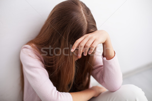 Depression in adolescence - young teenager girl sitting by the w Stock photo © ilona75