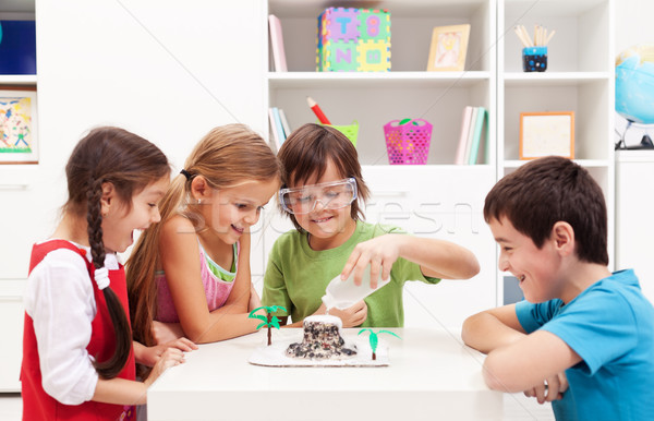 Stock photo: Kids observing a science lab project at home