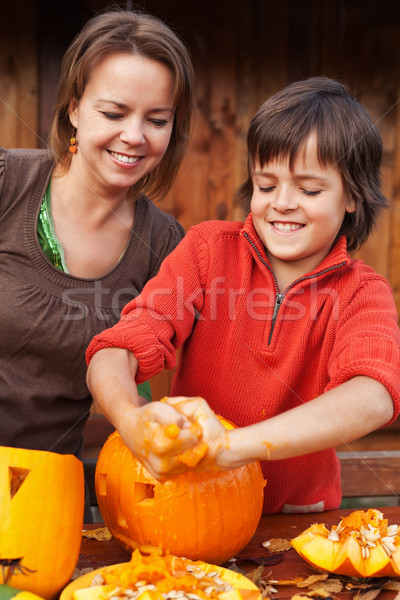 Boy having fun carving a jack-o-lantern for Halloween Stock photo © ilona75