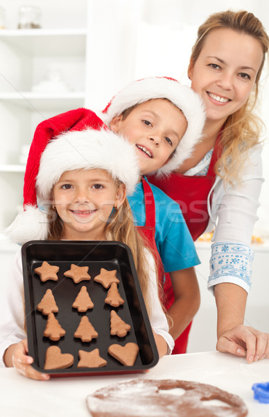 Happy family baking gingerbread cookies Stock photo © ilona75