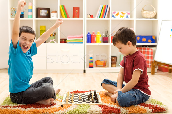 Kids playing chess - just captured a pawn Stock photo © ilona75