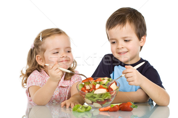 Heureux enfants manger salade de fruits souriant printemps [[stock_photo]] © ilona75