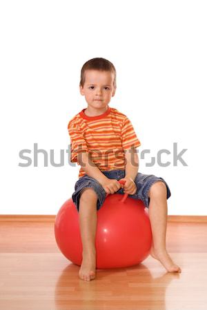 Serious boy with gymnastic ball Stock photo © ilona75