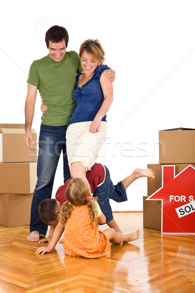 Stock photo: Happy family with kids in their new home