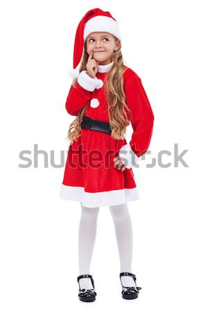 Stock photo: Happy christmas girl thinking of her presents