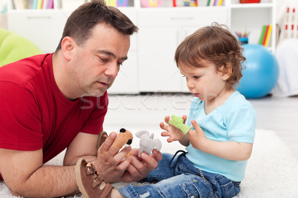 Father and toddler son playing Stock photo © ilona75