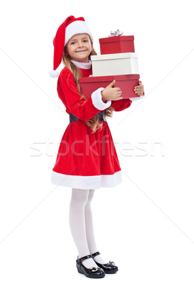 Happy girl in santa outfit holding presents Stock photo © ilona75