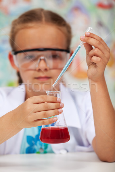 Young student in chemistry class doing an experiment Stock photo © ilona75