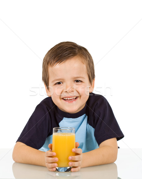 Little boy with a glass of fruit juice Stock photo © ilona75