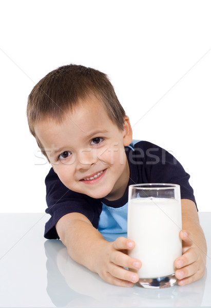 Happy kid with a glass of milk Stock photo © ilona75