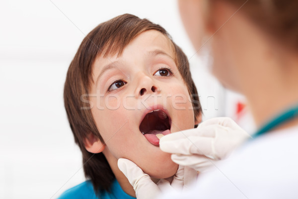 Say aaah - little boy at the doctor Stock photo © ilona75