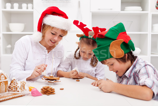 Happy christmas family decorating gingerbread cookies Stock photo © ilona75