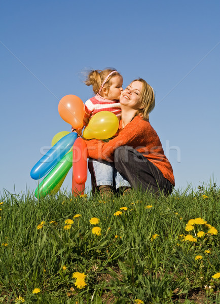 Cute girl kissing her mother Stock photo © ilona75