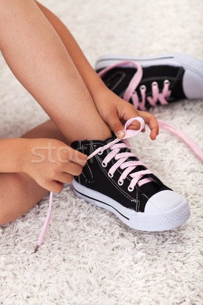 Child hands tie shoelaces Stock photo © ilona75