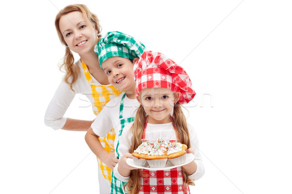 Chefs brigade preparing muffins - woman with kids Stock photo © ilona75