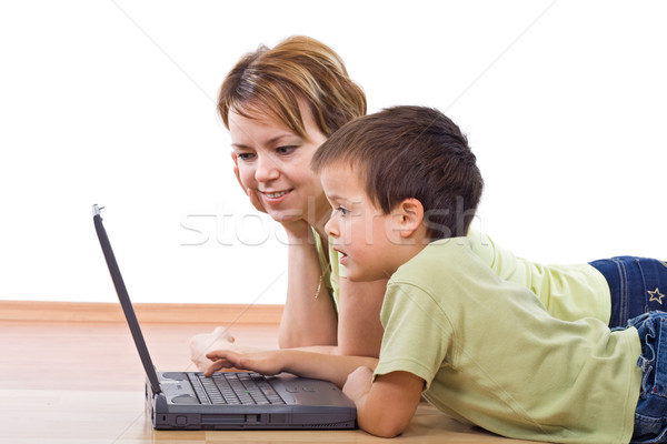 Mother and child surfing the net together Stock photo © ilona75