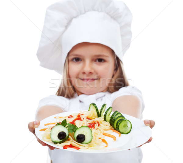 Little chef presenting a plate of pasta Stock photo © ilona75