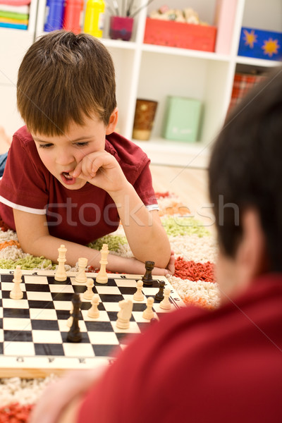 What should I do now - kid playing chess thinking Stock photo © ilona75