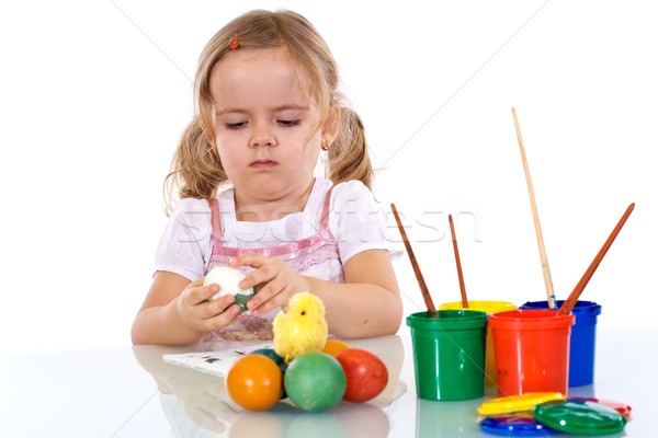 Little girl painting the easter eggs Stock photo © ilona75