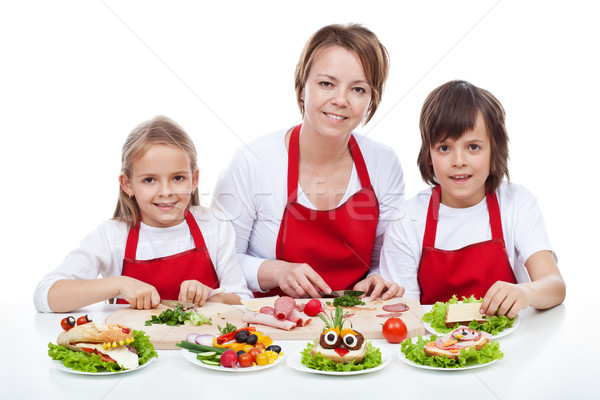 Woman and kids making creative food creature sandwiches Stock photo © ilona75