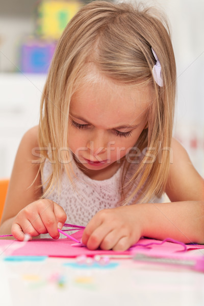 Little girl working on a crafting project Stock photo © ilona75