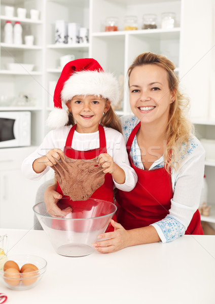 Christmas woman and little girl making gingerbread cookies Stock photo © ilona75
