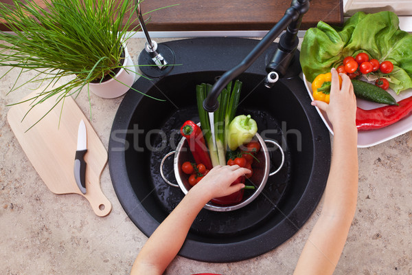 Girl hands washing vegetables for a healthy salad Stock photo © ilona75